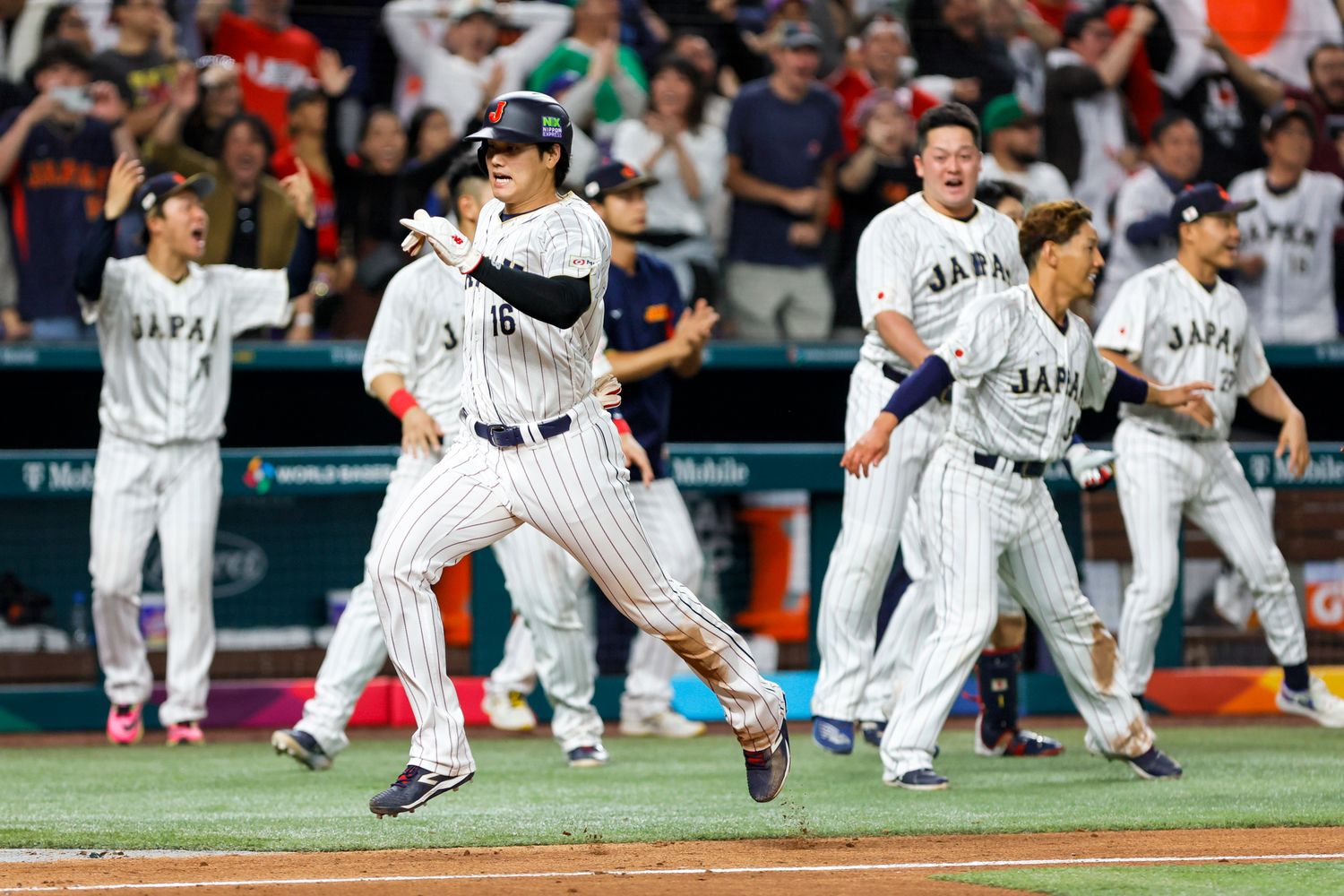 Shohei Ohtani scores a run during the World Baseball Classic.